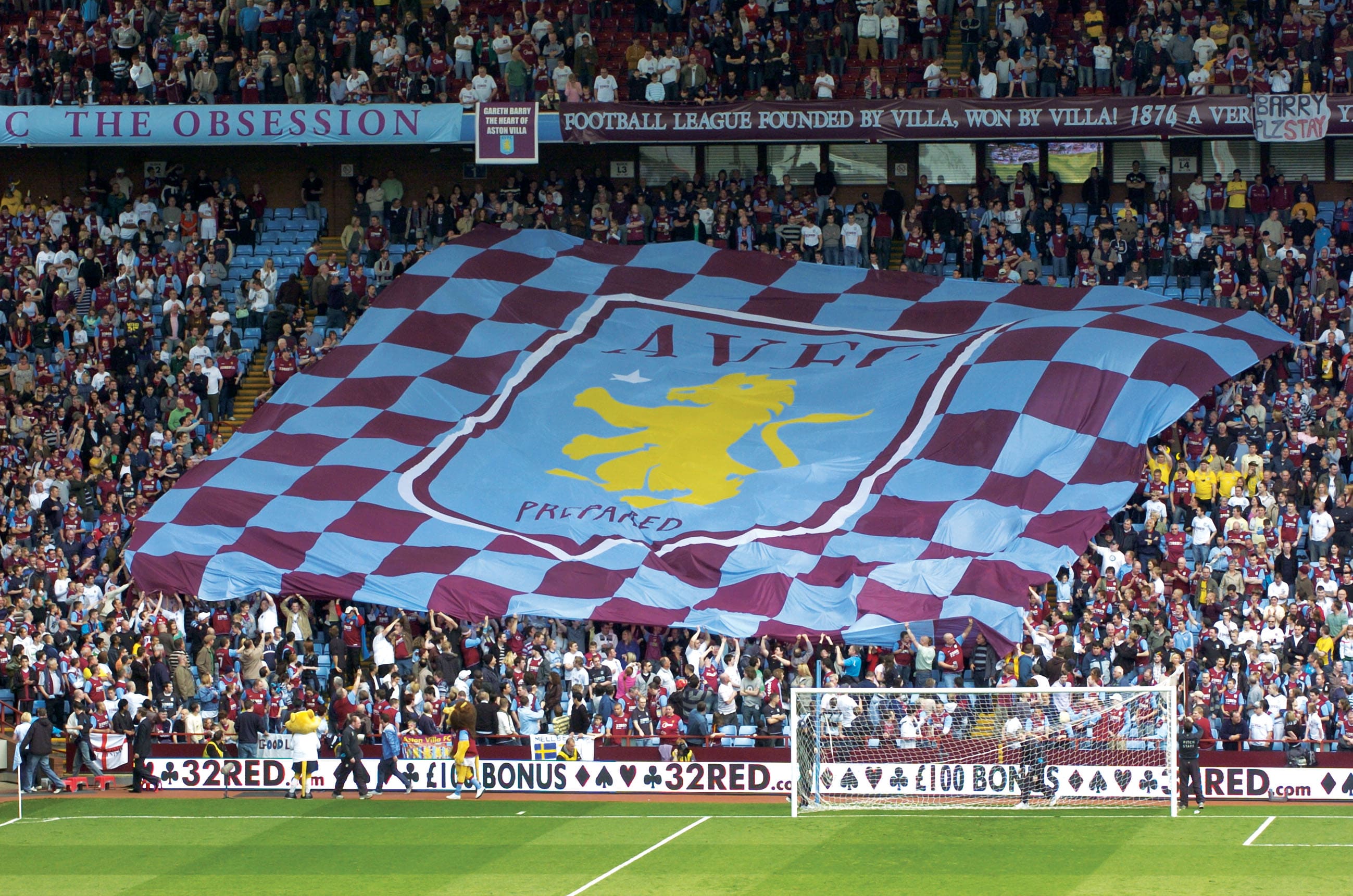 Promotional flags, large crowd flag displayed by people at a football game.