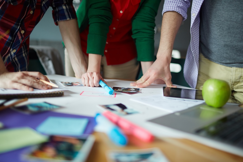 display banner advertising,  team of designers brainstorming the design and colour scheme
