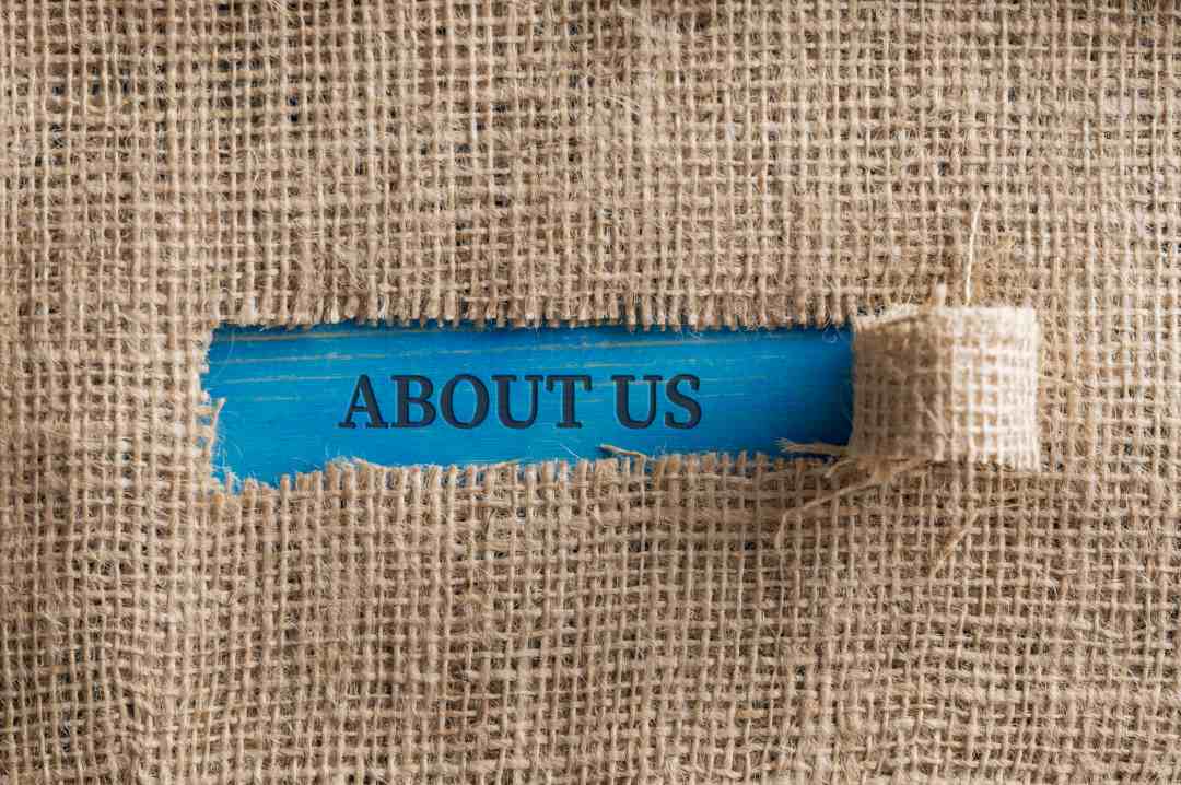 display stands, about us written on a paper