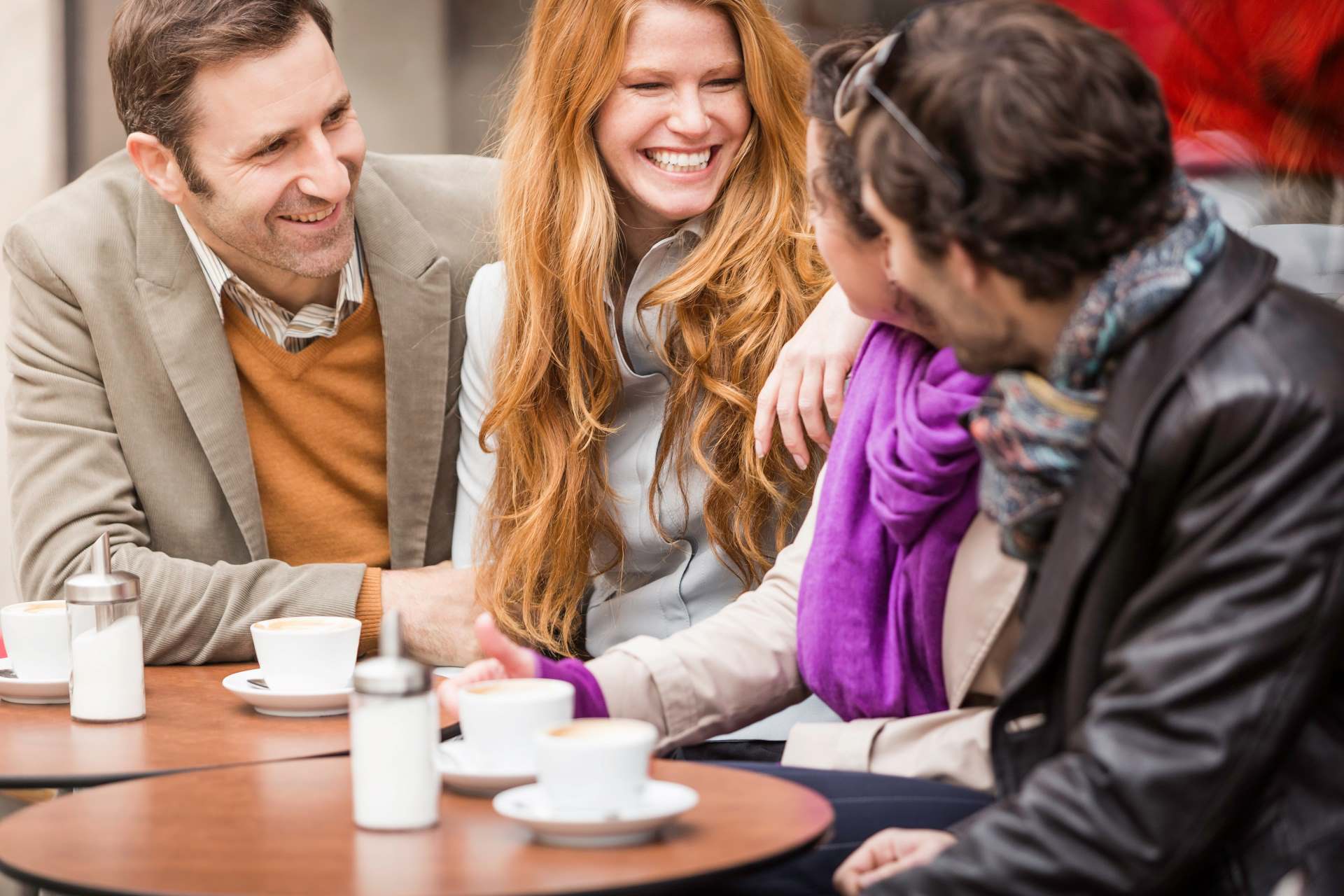 outdoor display, a group of friends enjoying at an outdoor cafe