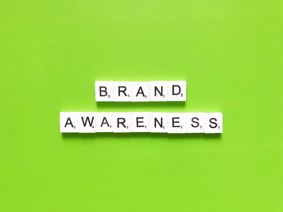 custom business signage, letter tiles spelling out brand awareness