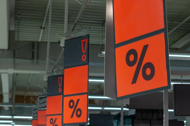 Hanging sale signs in a store