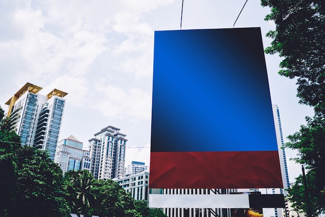 Street-Level Marketing, large banner outdoors.