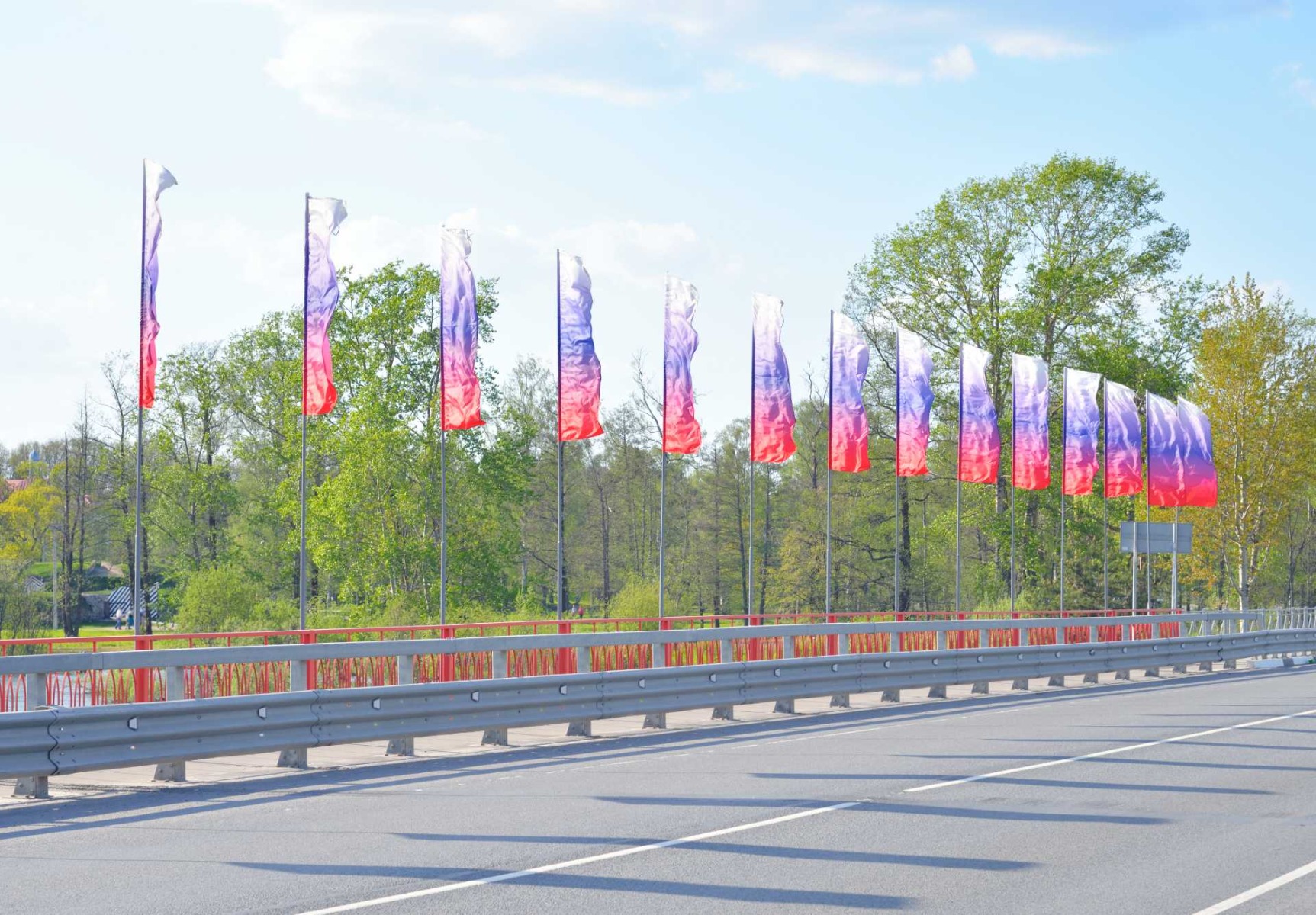 branding ideas to improve crowd participation, colourful flags lined up on a road.