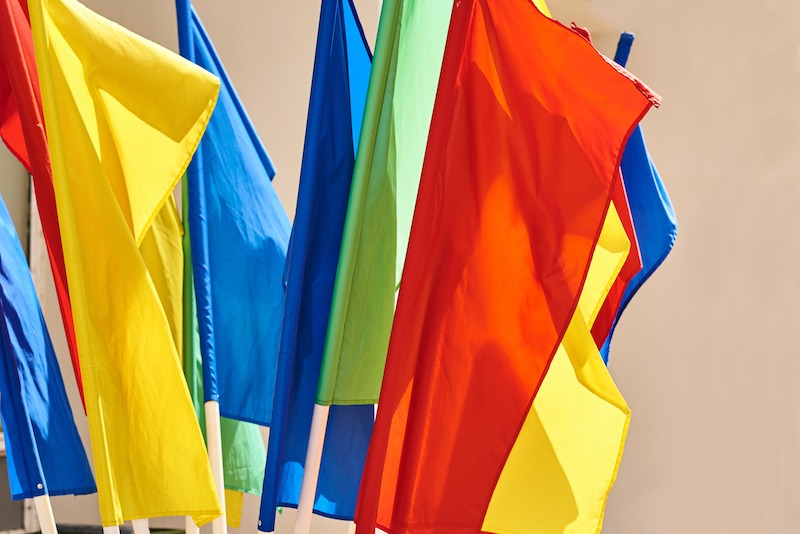 Custom feather flag design tips, multiple colourful flags.