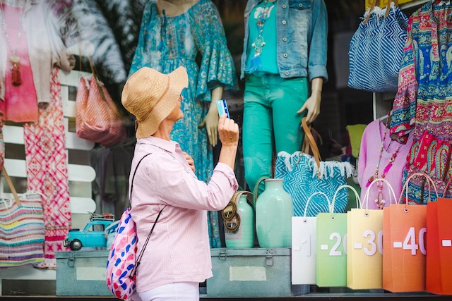 Tell a Brand Story, woman looking at retail window display.