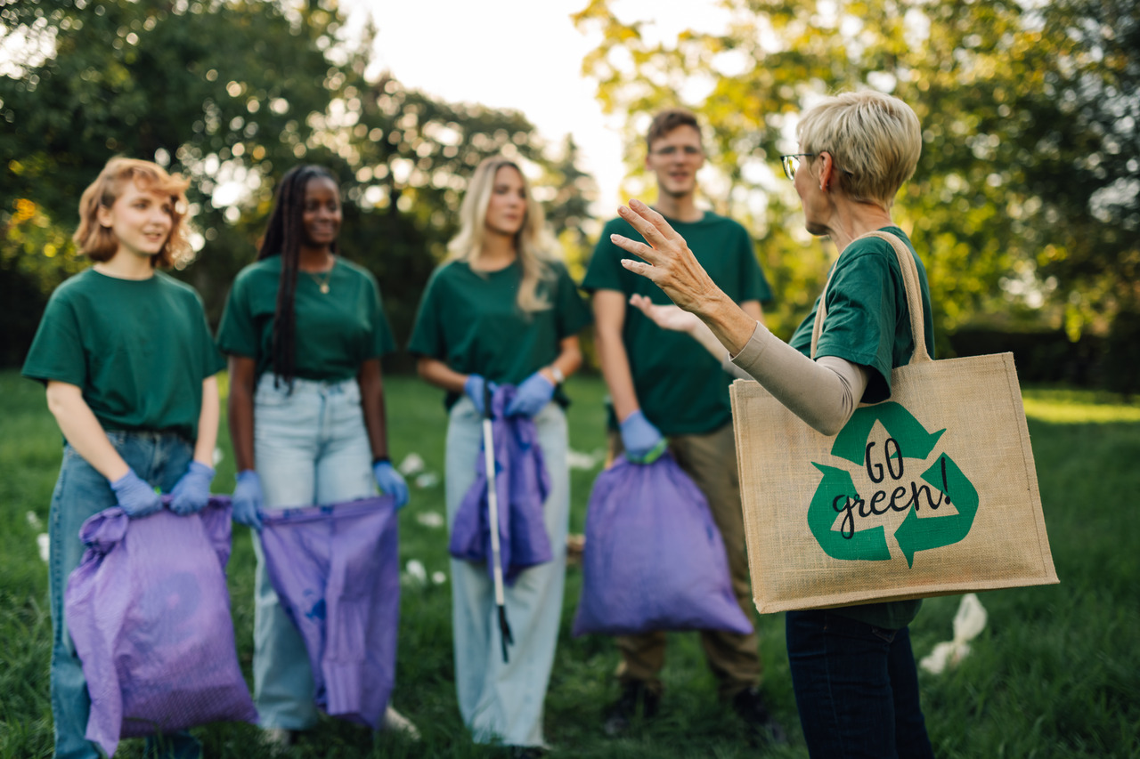 A brand team engaged in waste clean up as part of its green advertising campaign