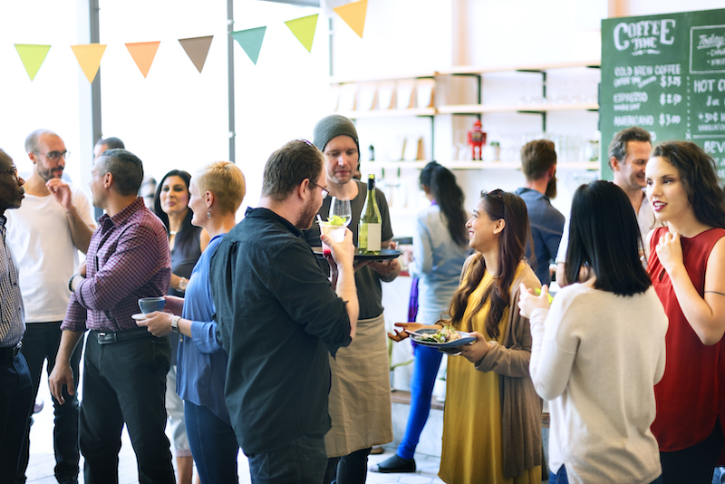 In-store marketing tactics, event in the store with drinks and food served.