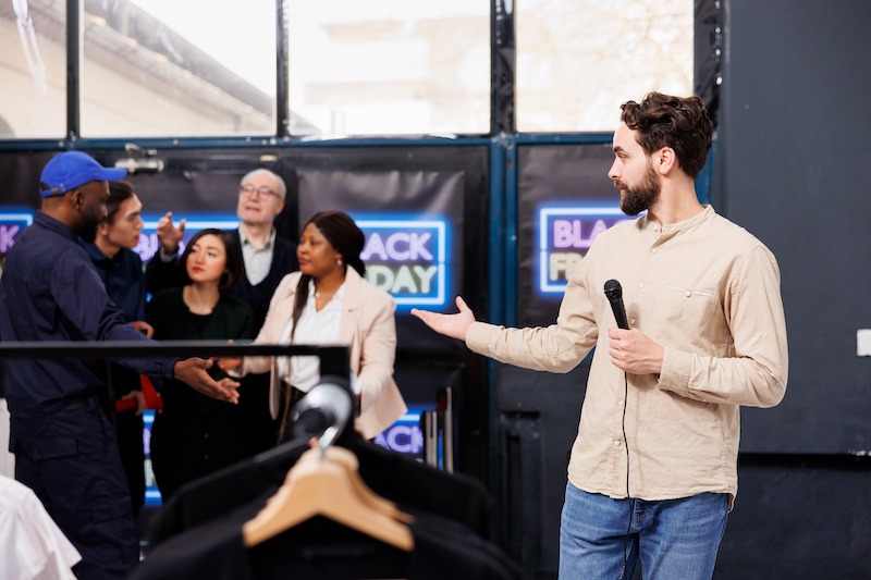Experiential Retail Marketing, a person hosting a Black Friday retail store event.