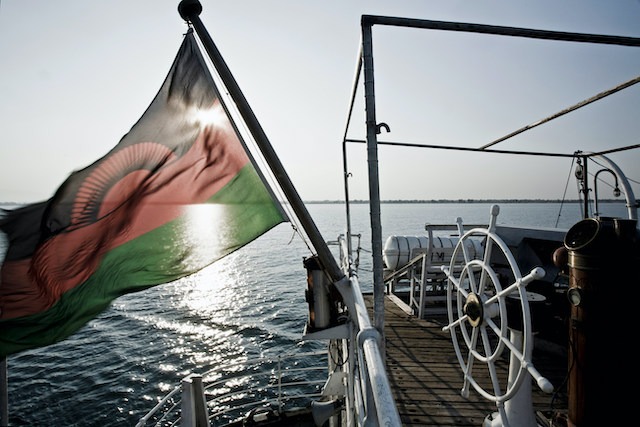 Boat Flag Etiquette, Mozambique flag flying from a boat.