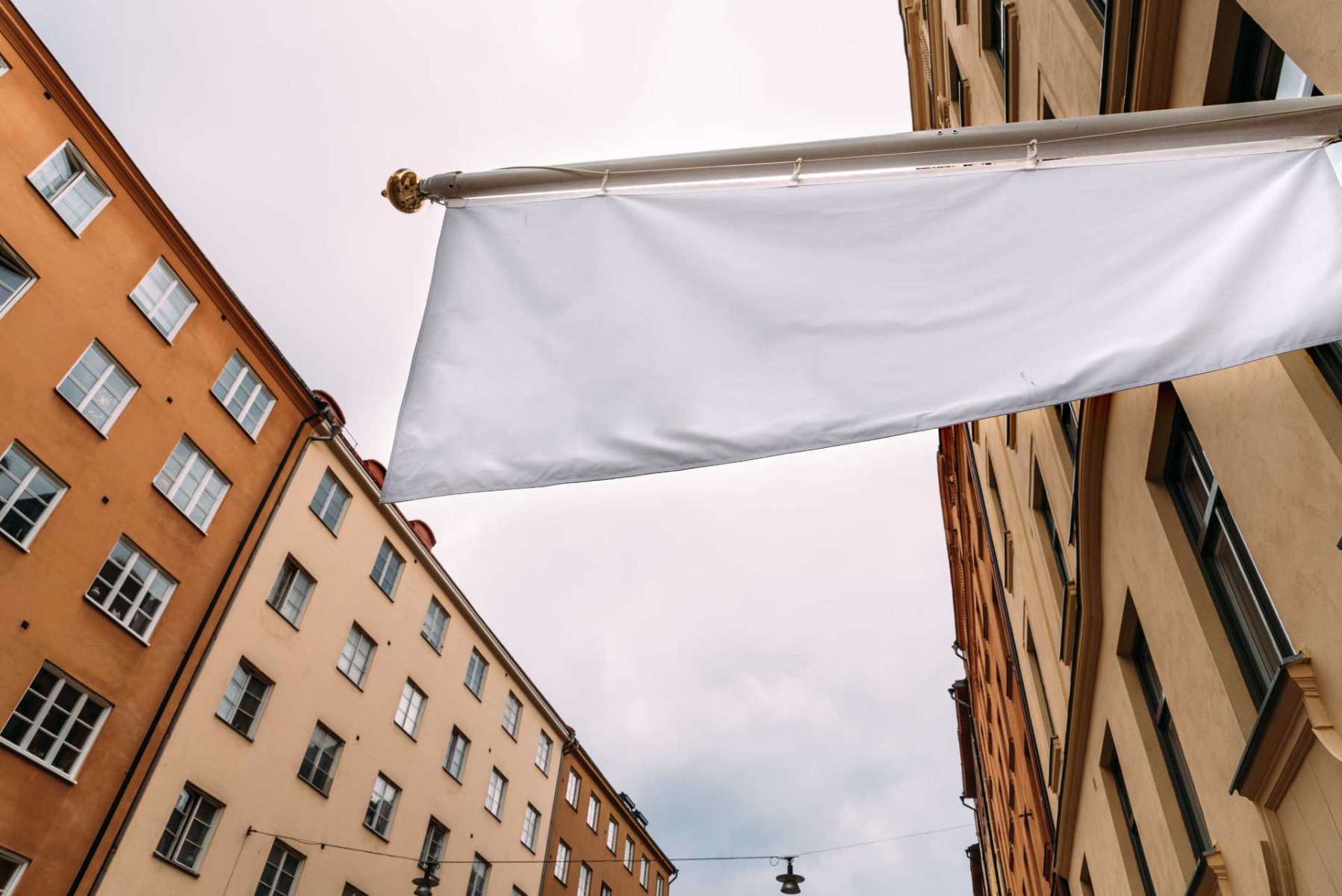 Preventing flagpole damage, A blank white flag on a building.