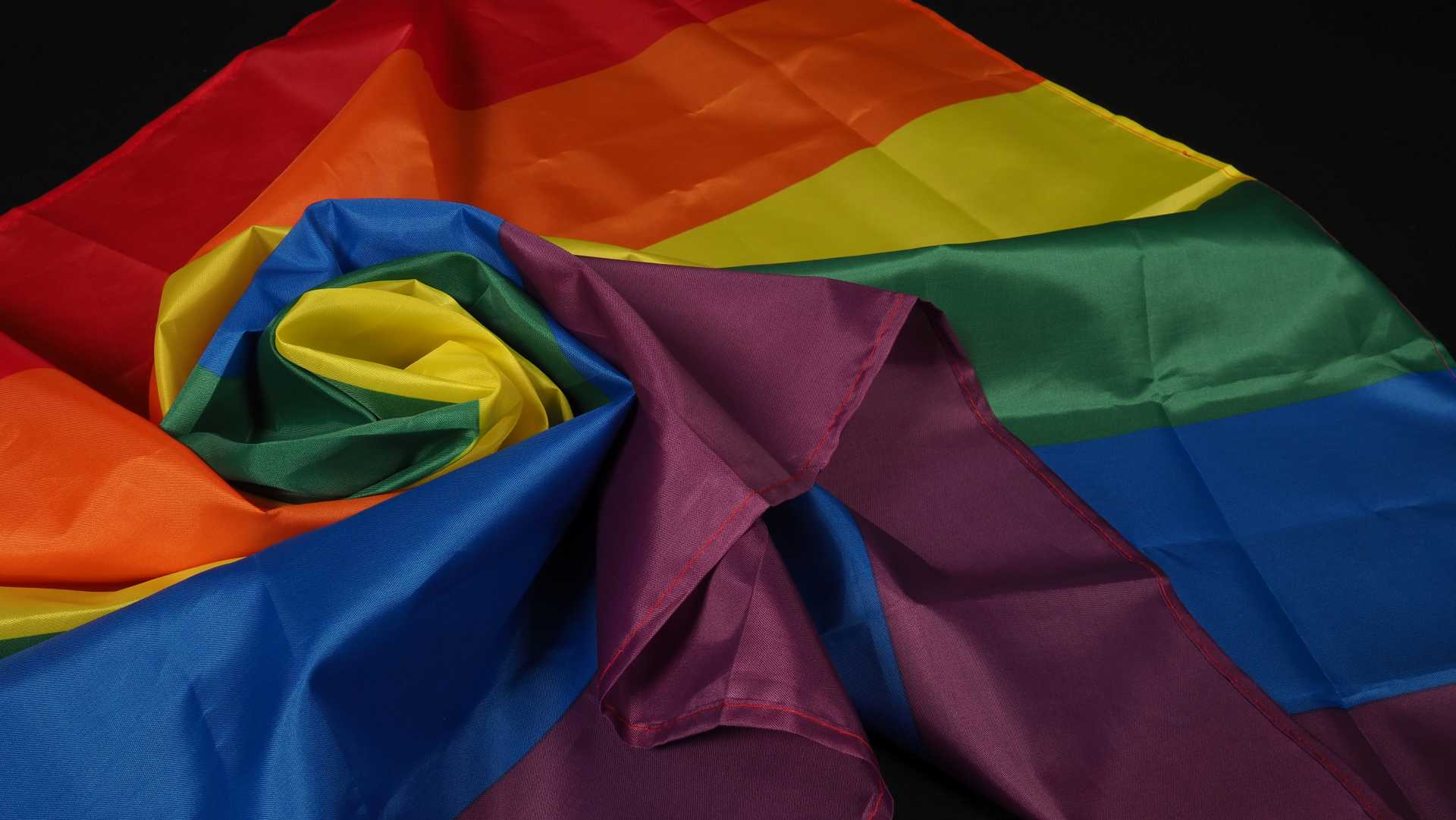 why flags become damaged, an incorrectly folded pride flag.