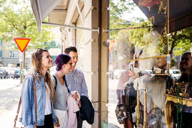 Street-Level Marketing, passers-by looking at shop window.