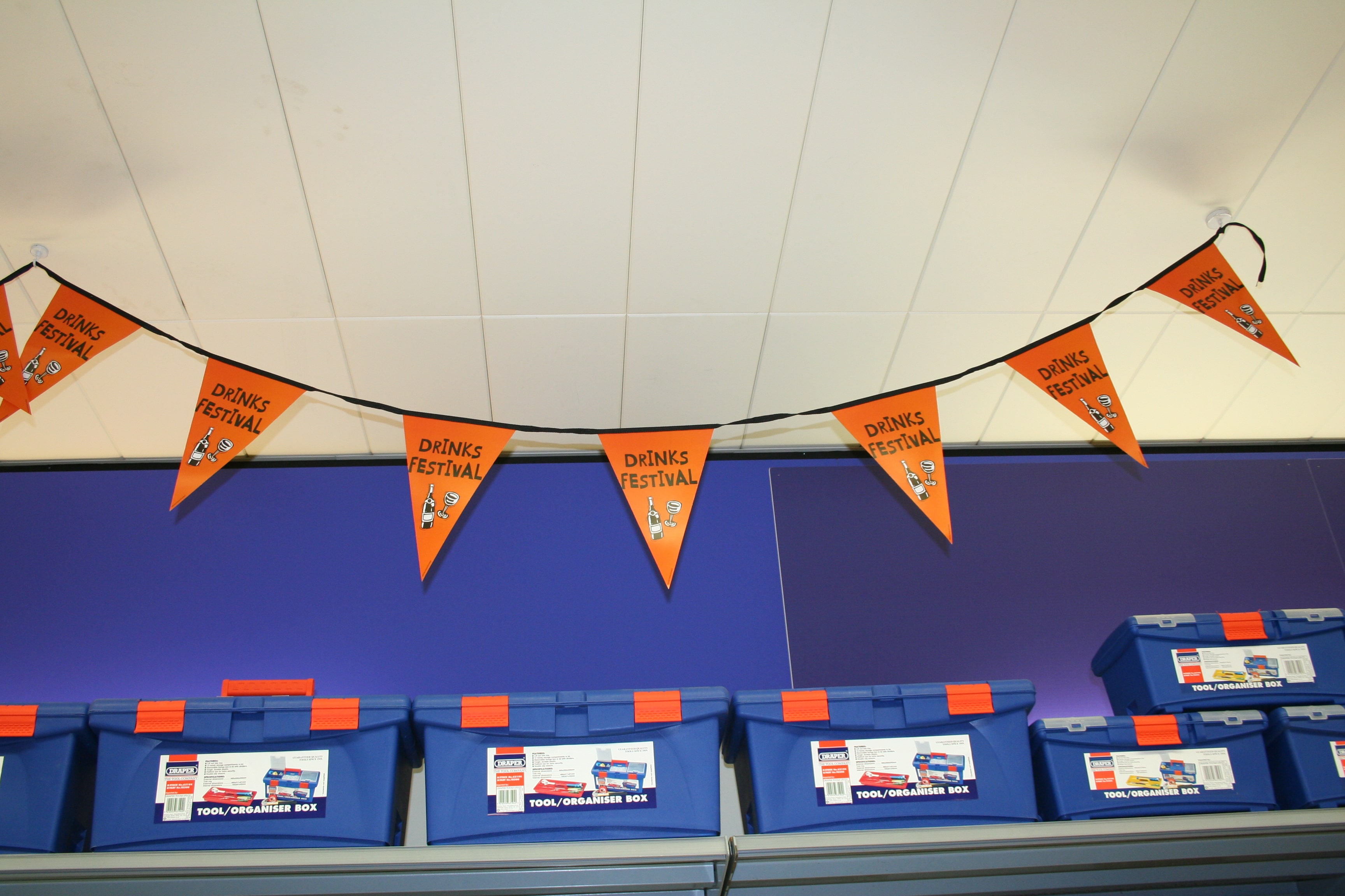 Halloween decorations, customised orange buntings on the ceiling.