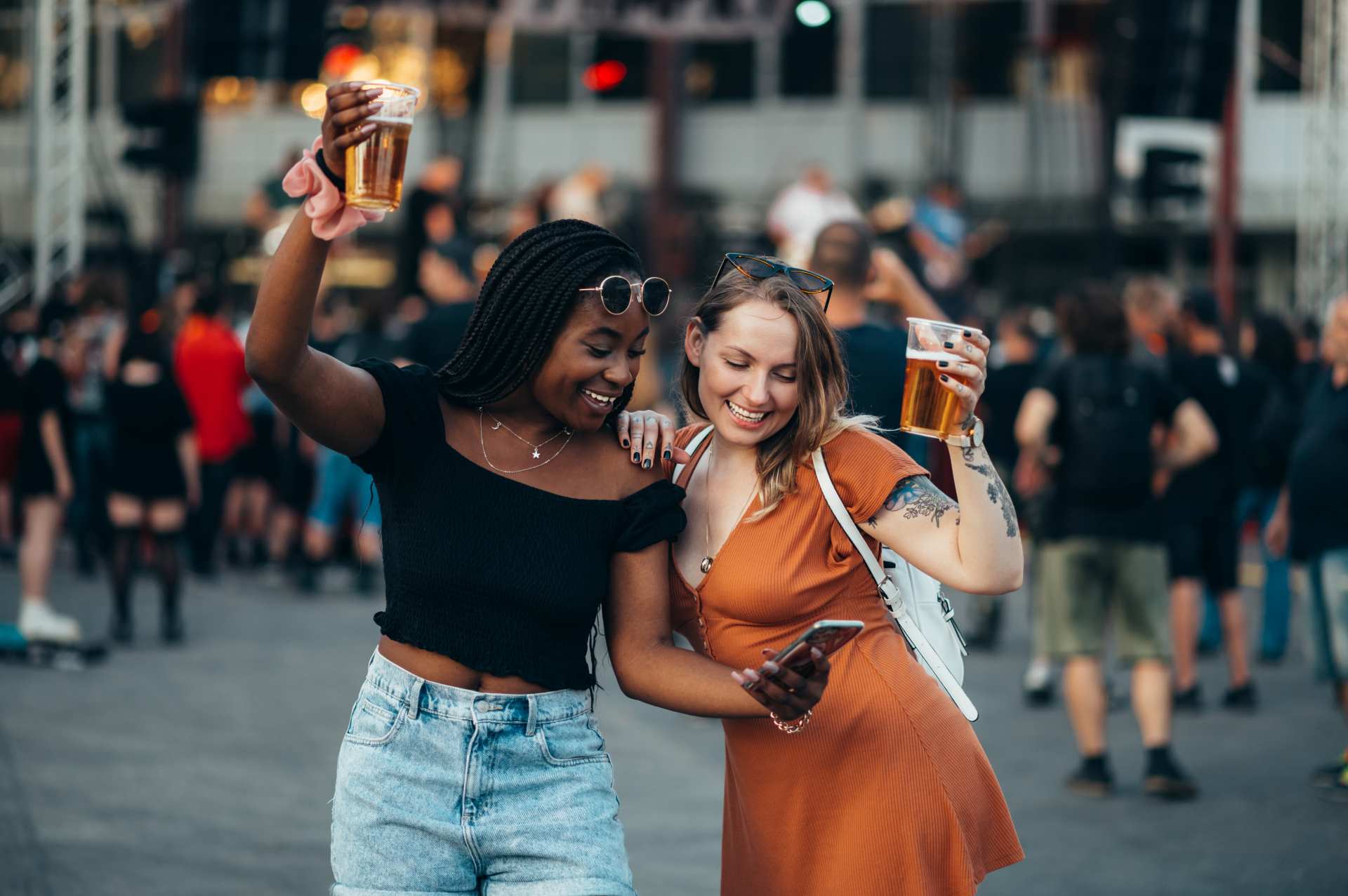 pop up trade show display, girls enjoying the festival time with a glass of beer.