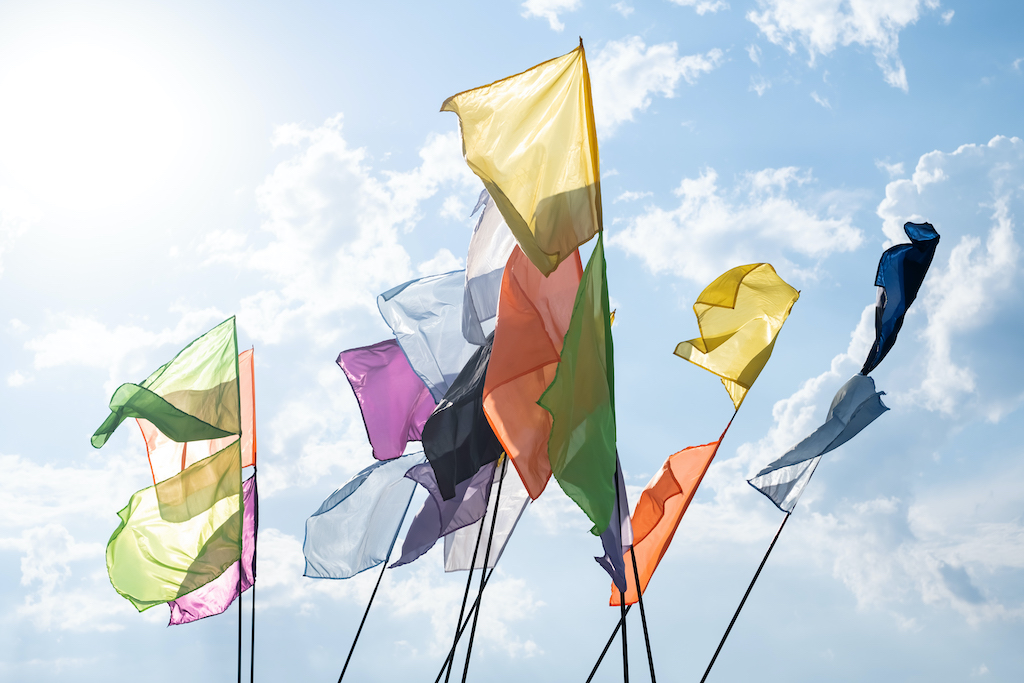 Feather flag designs, colourful flags swaying in the wind.