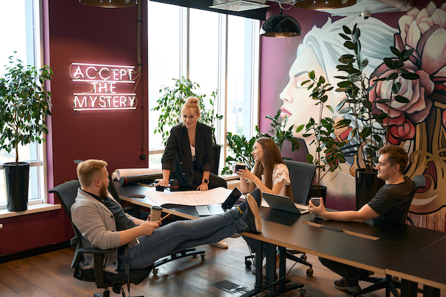 Commercial Property Advertising, people in an office with a mural on the wall.